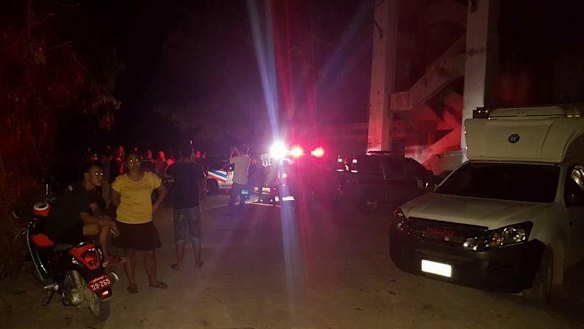 Police at the scene where an 11-month-old girl and her father were found dead.