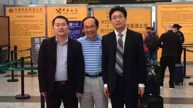 UTS academic Professor Feng Chongyi at the Guangzhou Airport on Saturday afternoon with his lawyers Chen Jingxue (left) and Liu Hao (right) after being questioned by police.