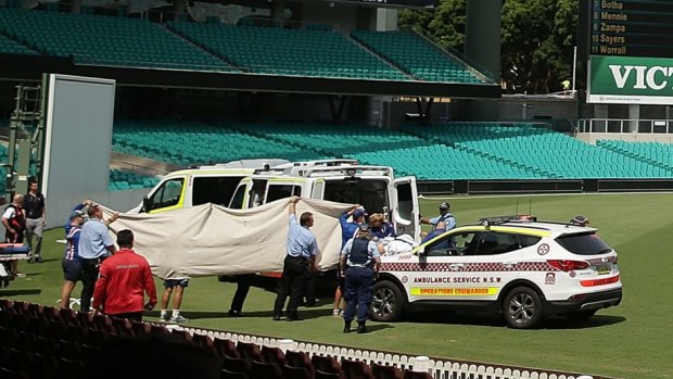 Paramedics treat Phillip Hughes at the Sydney Cricket Ground on Tuesday.