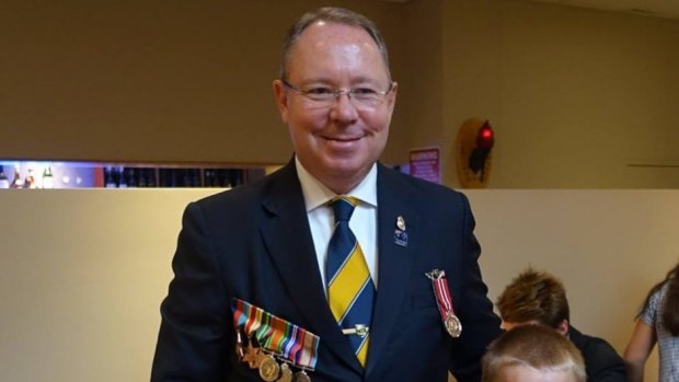 This photo from Hugh McDermott's Facebook page shows him wearing the Australian Individual Readiness Notice (AIRN) badge on Anzac Day last year. The badge is just above the medal he's wearing on the left breast pocket of his suit.