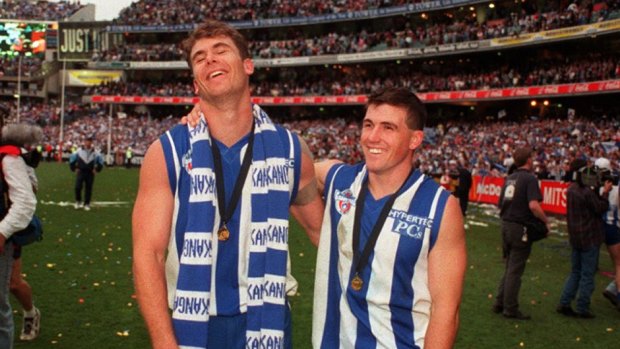 Carey and Anthony Stevens as teammates, after North Melbourne's 1996 grand final win.