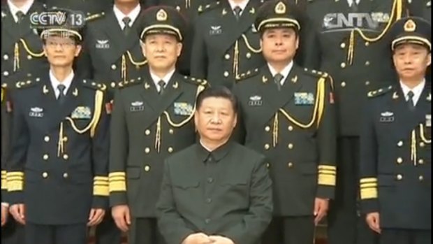 Chinese President Xi Jinping (seated) with Lieutenant-General Yang Xuejun (second from right, front row). 