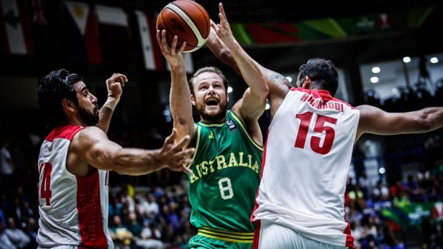 Australia's Brad Newley drives to the basket in the gold medal game.