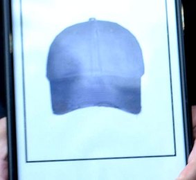 An artist's impression of the baseball cap that the alleged offender was wearing.