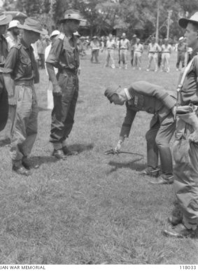 Major General Uno surrenders to Lieutenant Colonel Ewan Murray Robson, during the Japanese surrender ceremony.