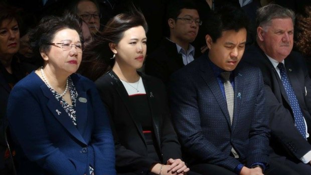 Selina Cheng with her children Zilvia and Alpha and Detective Chief Inspector Russell Oxford at the unveiling of a plaque renaming Police Headquarters at Parramatta the Curtis Cheng Centre.