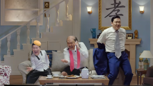 Three generations of garish characters, all played by Psy, in the clip.
