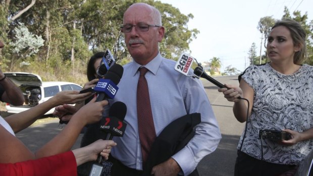"There will be no OJ Simpson situation": lawyer Paul Kenny arrives at Roger Rogerson's home.