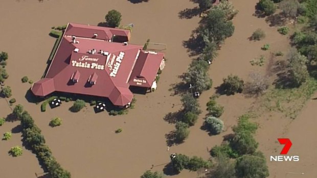 The landmark Yatala Pies store south of Brisbane surrounded by floodwater.