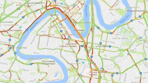 Traffic has backed up into the city after three-vehicle crash on Pacific Motorway.