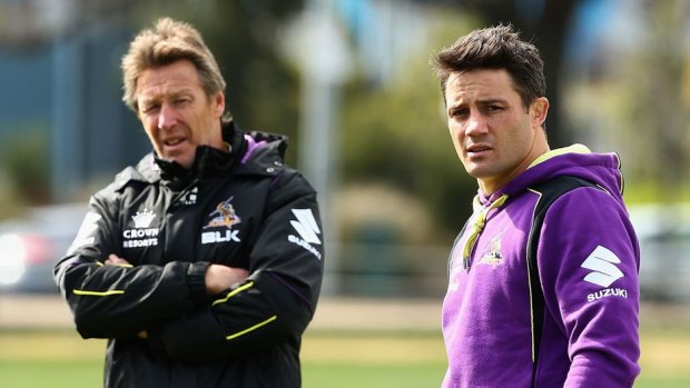 Melbourne Storm's Cooper Cronk, pictured with coach Craig Bellamy, says the AFL could handle NRL-type player movement rules. 