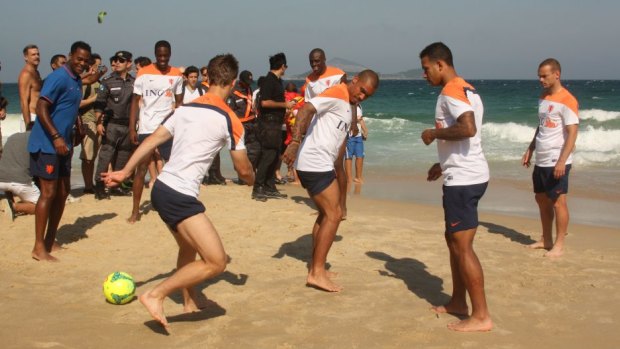 The Dutch players show off their skills on the beach.