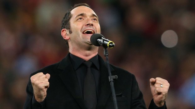 Darren Percival performs the national anthem during game three of the 2012 State of Origin series. 