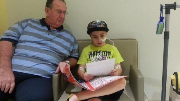 Grantham floods survivor John Mahon with grandson Liam, now 10.
