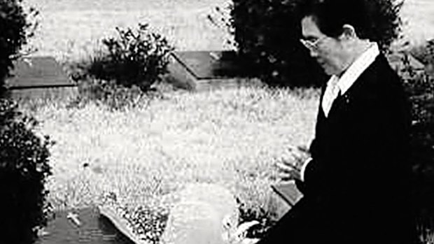 Korean War widow Kim Chung Kun lays flowers at Vincent Healy's grave several years after Mrs Healy's visit which inspired Mrs Kim's annual pilgrimage.