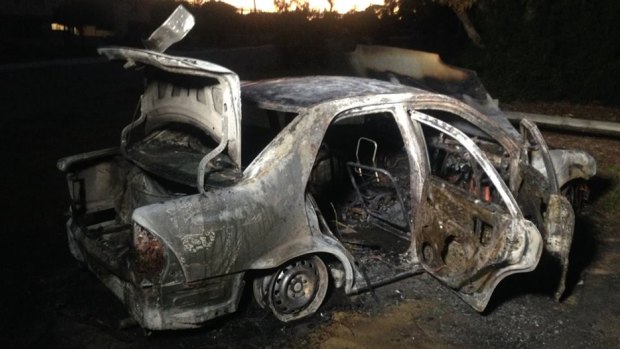 One of the cars torched at an oval in North Beach.