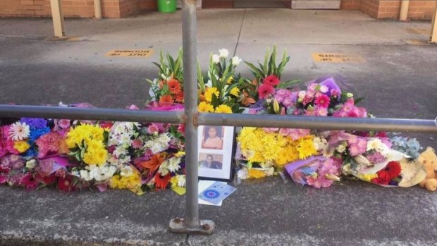 Students left flowers and photographs in tribute to Amir at Robert Townson High School.