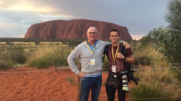 Michael Gordon on assignment with photographer Alex Ellinghausen in Uluru in 2017.