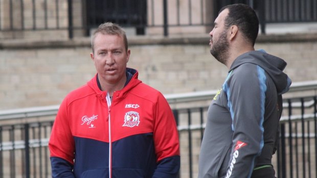 Friends: Roosters coach Trent Robinson and Wallabies mentor Michael Cheika.