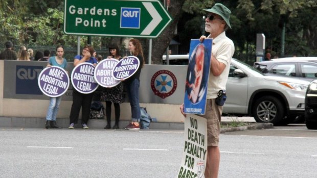 Pro- and anti-abortion protesters gathered outside Brisbane's Parliament House in May.