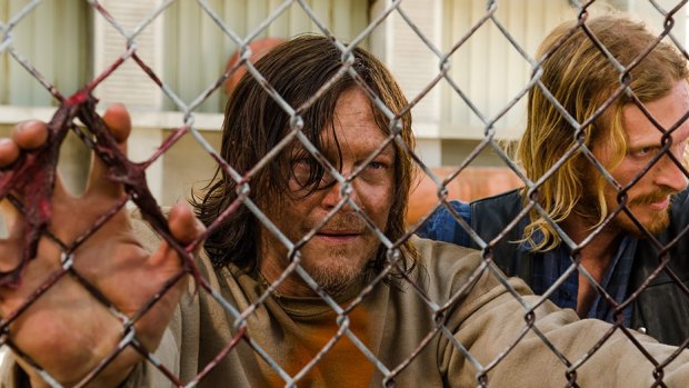 Please make it stop: Daryl (Norman Reedus) is tortured like never before by Dwight (Austin Amelio).