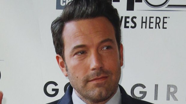 Ben Affleck has been seen with a red and yellow phoenix tattoo that covers his entire back but claims it is "fake".