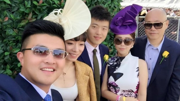 Andrews government adviser Mike Yang (left) with Tian Di (right) and Sisly Tian (second from right) at the Spring Racing Carnival in 2015.