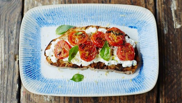 Bruschetta topped with sun-dried and fresh tomatoes, and whipped ricotta.