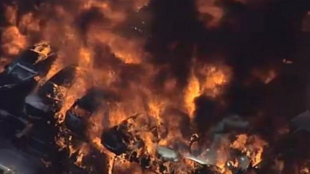 Frame grab of massive fire at a car disposal yard in Revesby, Sydney.