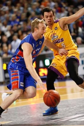 Meltdown: Adelaide guard Brendan Teys gets around Kings counterpart Jason Cadee during Sydney's capitulation at the hands of the 36ers.