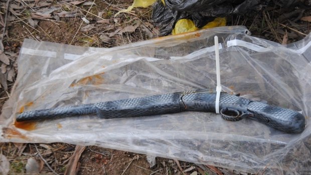 A shotgun was found wrapped in a plastic bag and buried at Kambah on Sunday.