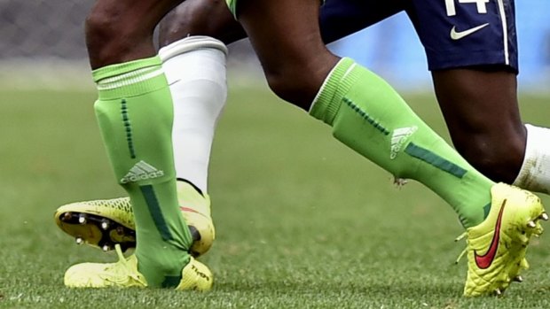 France's Blaise Matuidi fouls Nigeria's Ogenyi Onazi.