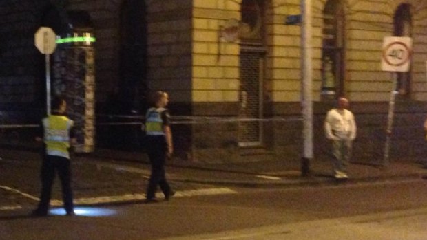 Police at the scene of a serious assault in Fitzroy on Friday night. 