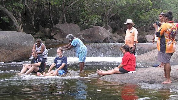 Queensland Police officers John Melandri (left) and Wil Devlin during their induction into the Kuku-Yalanji Clan.