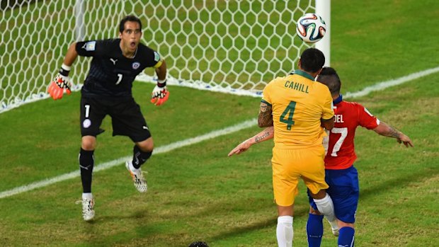 Dream goal: Tim Cahill heads in for Australia.