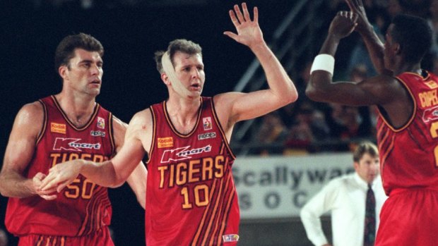 Back in the day: Andrew Gaze, centre, in action.