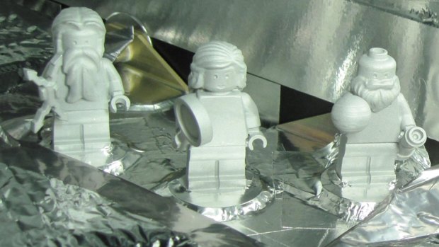 Three LEGO figurines representing the Roman god Jupiter, his wife Juno and Galileo Galilei are shown here aboard the Juno spacecraft.