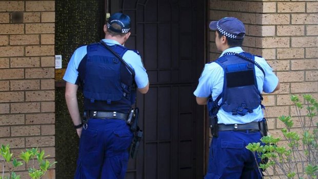 Police visit the boy's Auburn home the day after his arrest.