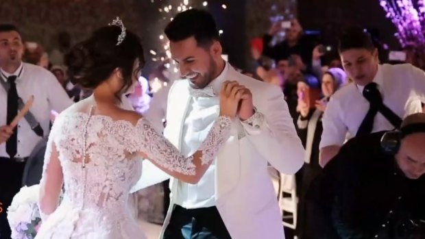 Salim Mehajer and his wife Aysha dance in a screenshot of the video from the garish wedding reception.