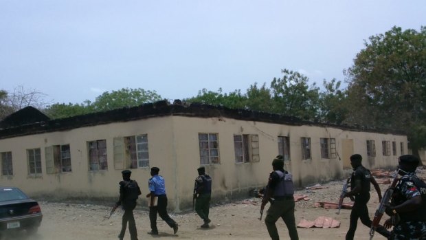 Security forces at the government school three days after gunmen abducted nearly 300 girls