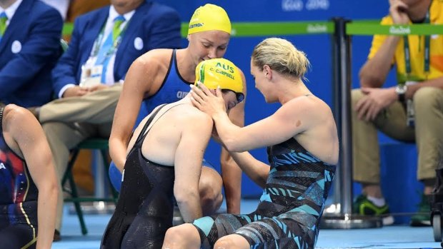 Support: Cate Campbell is comforted by Sweden's Sarah Sjostrom and Denmark's Jeanette Ottesen after her shock 100m loss.