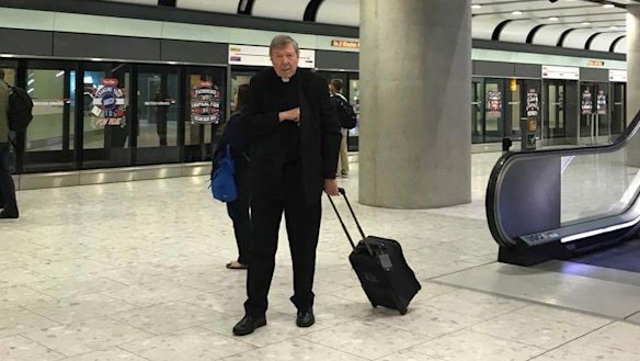 Cardinal George Pell at Heathrow on Friday after flying business class from Rome.