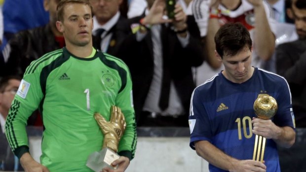 Little consolation: Messi looked less than thrilled with his Golden Ball award.