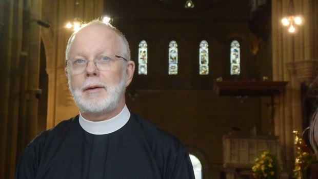 Brisbane's Anglican Dean Peter Catt says he is willing to put himself between police and asylum seekers.