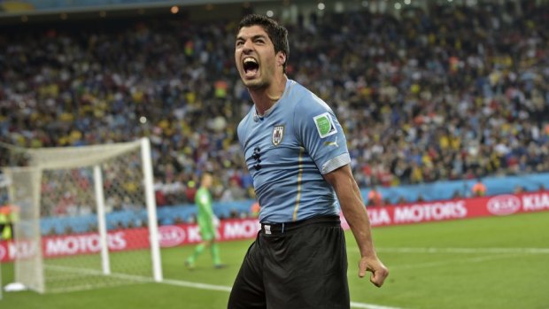 Big match: Luis Suarez and Uruguay face Italy with both sides chasing a spot in the last 16.