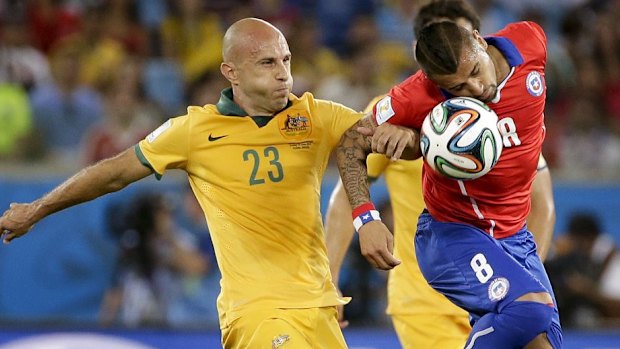 Mark Bresciano and Arturo Vidal battle for the ball.