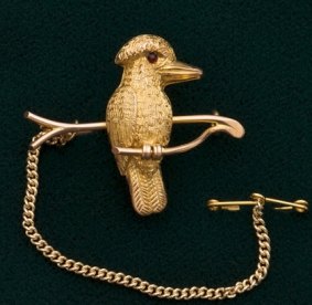Nine carat gold brooch with a kookaburra on a branch, by Duggin, Shappere & Co. Melbourne, $2500.
