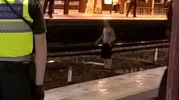 Man on the tracks at Flinders Street.