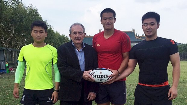 New frontier: Paul Broughton with three Chinese rugby league players. 