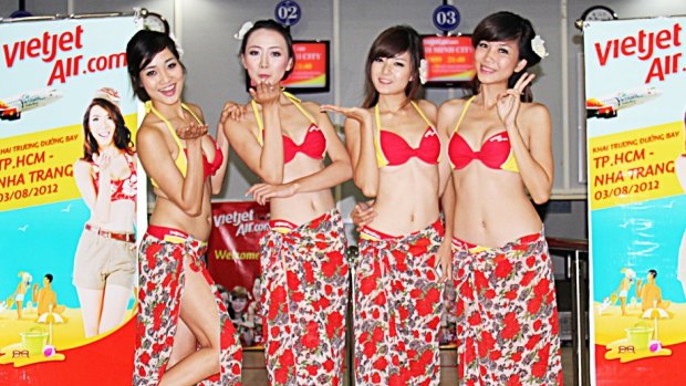 VietJet is known for its young and attractive flight attendants who wear bikinis on inaugural flights to beach locations.